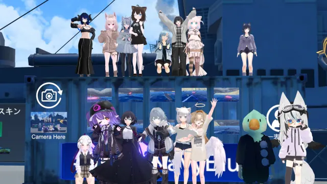 青空の下で集まった大勢のアバターの集合写真